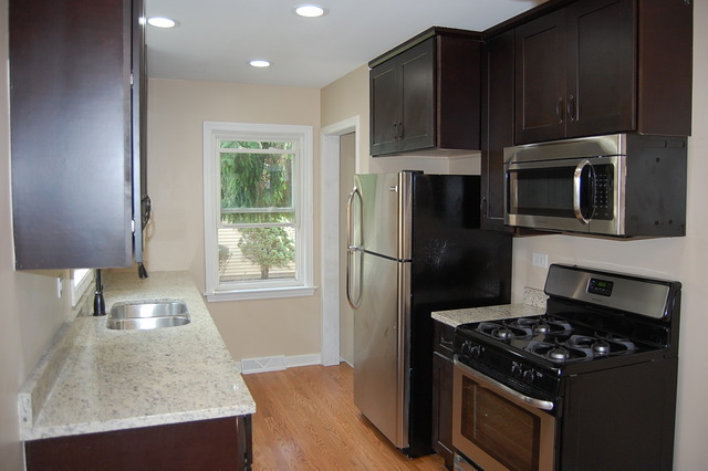 2227 Keystone Avenue North Riverside, IL 60546 - Photo 2 of 16 a kitchen with a stove a refrigerator and a sink