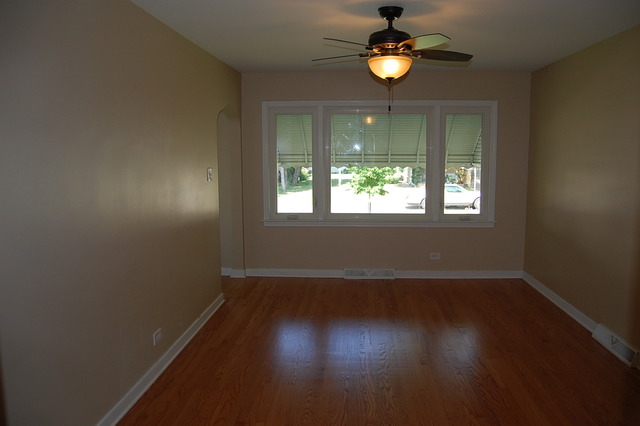 2227 Keystone Avenue North Riverside, IL 60546 - Photo 7 of 16 a view of an empty room with wooden floor and a window