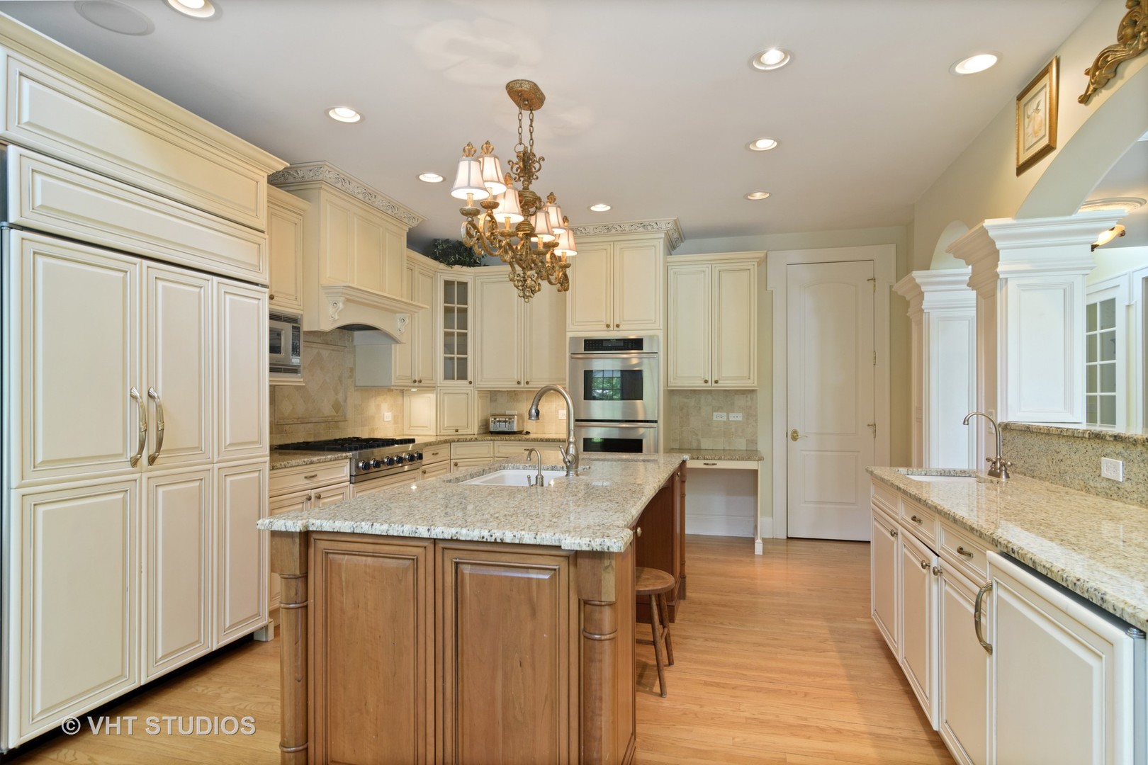 1885 West Durham Drive Inverness, IL 60067 - Photo 5 of 28 a kitchen with stainless steel appliances granite countertop a sink refrigerator and cabinets