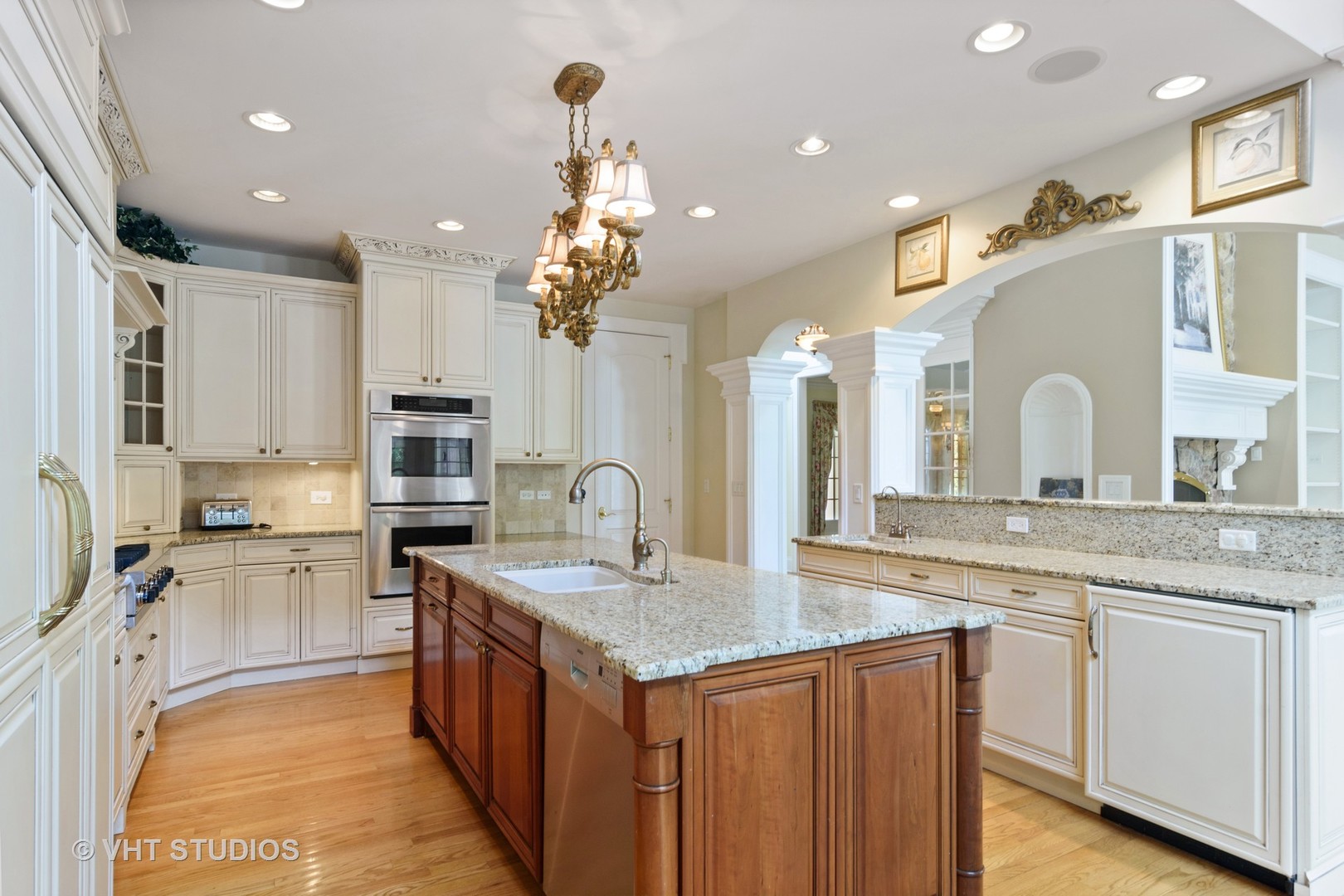 1885 West Durham Drive Inverness, IL 60067 - Photo 6 of 28 a large kitchen with stainless steel appliances kitchen island granite countertop a sink and cabinets