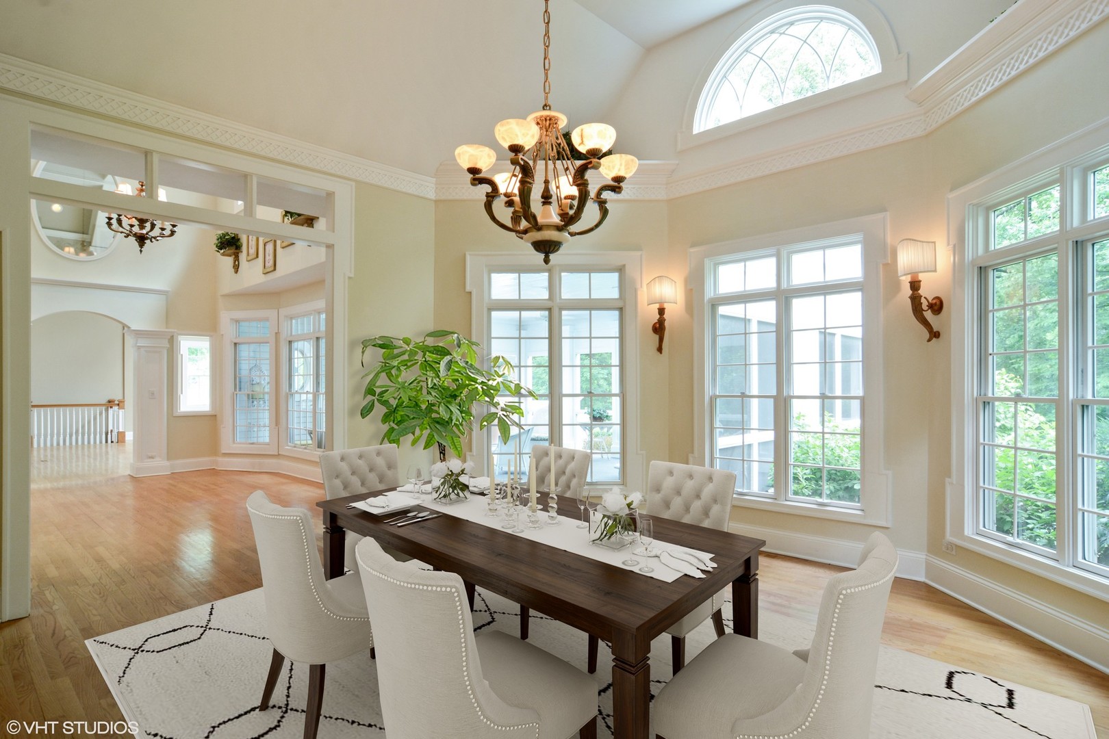 1885 West Durham Drive Inverness, IL 60067 - Photo 9 of 28 a view of a dining room with furniture a chandelier and large windows