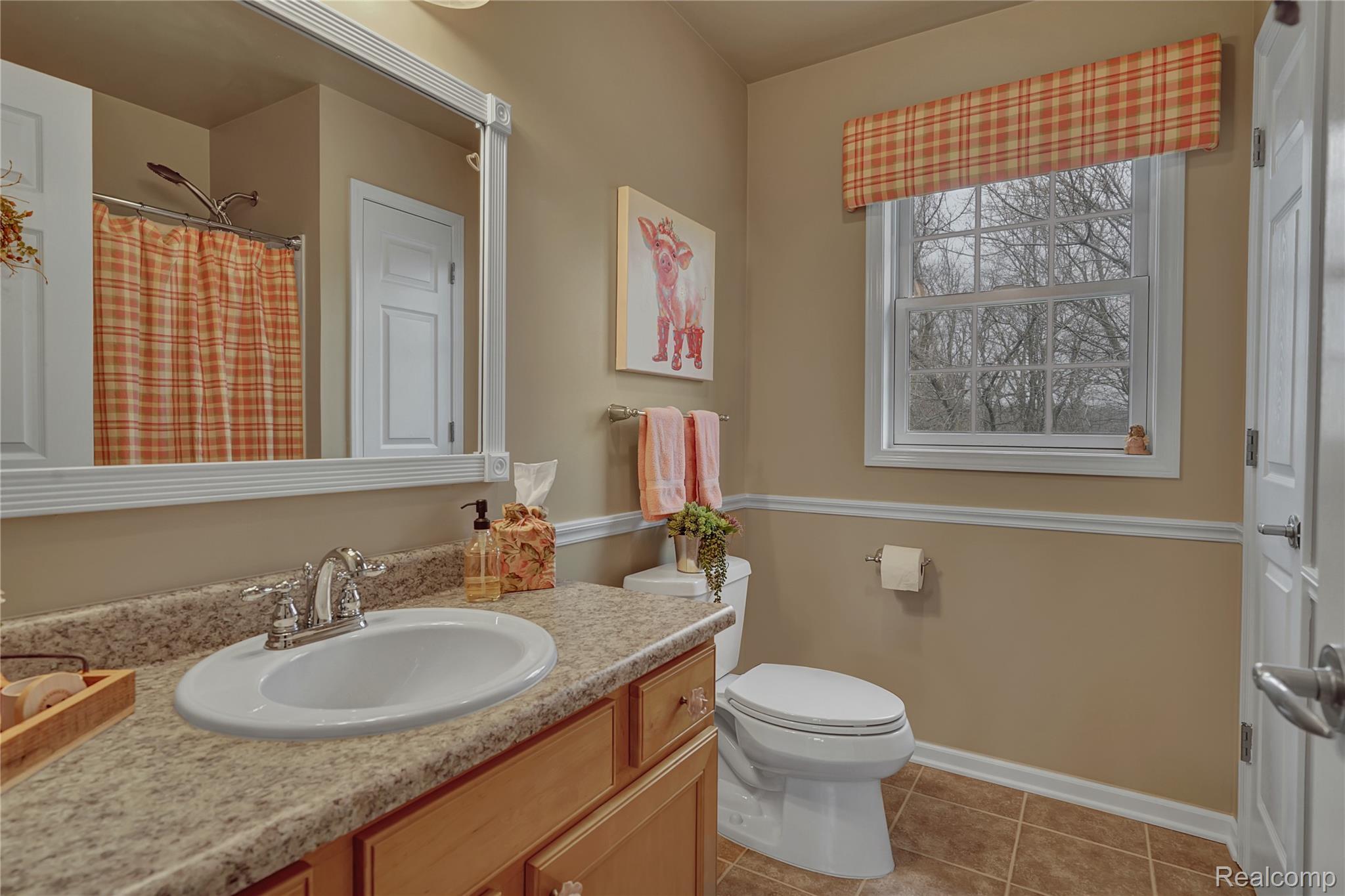 3690 Brauer Road Oxford, MI 48371 - Photo 33 of 63 Bathroom featuring vanity, a shower with curtain, and light tile patterned flooring