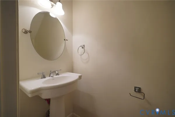 a bathroom with a sink and mirror