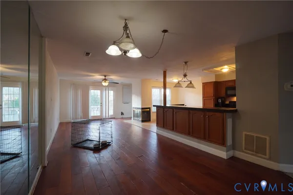 a view of a kitchen with a sink and cabinets