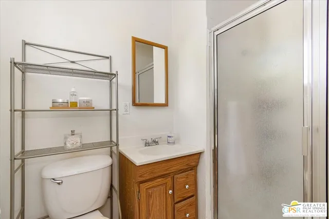 a bathroom with a sink a mirror and a toilet