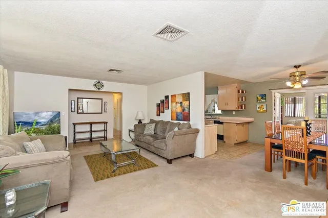 a living room with furniture and a table