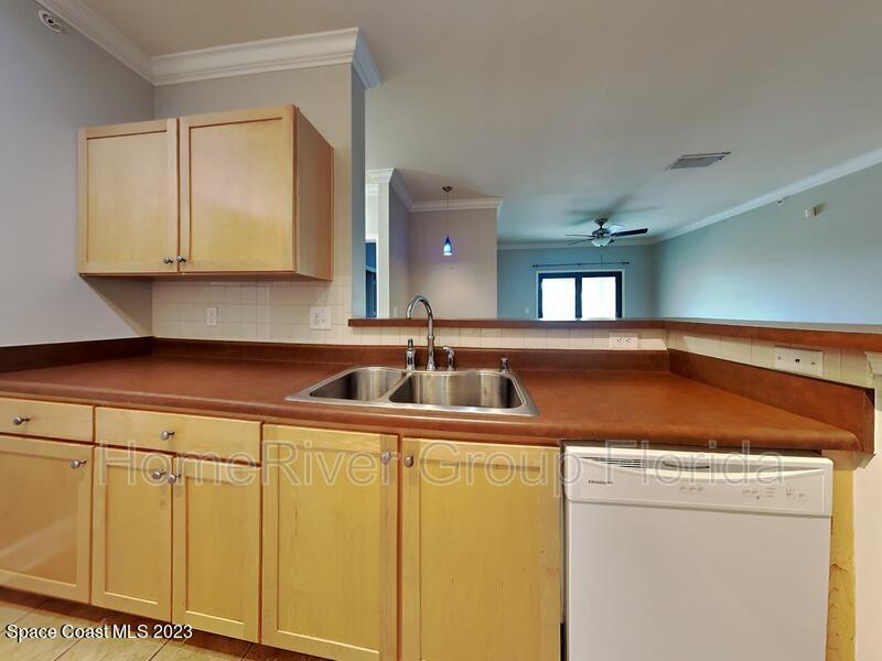 6450 Borasco Drive, Unit 3703 Melbourne, FL 32940 - Photo 12 of 13 a utility room with dryer and washer
