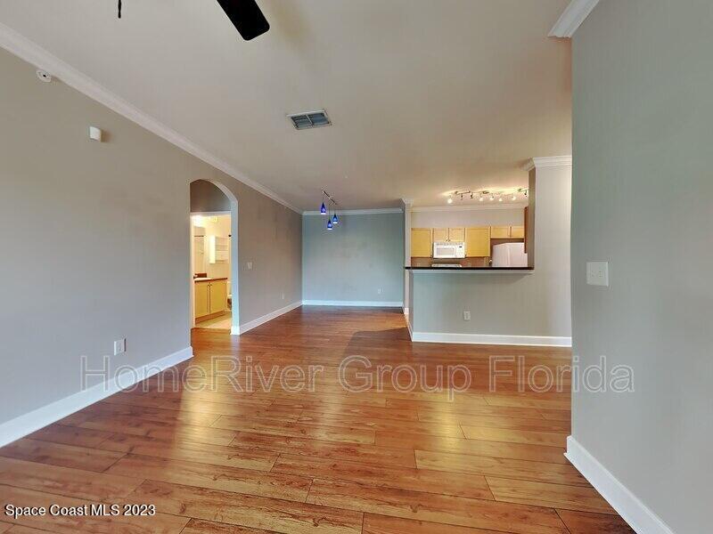 6450 Borasco Drive, Unit 3703 Melbourne, FL 32940 - Photo 3 of 13 a view of a kitchen with a sink and an oven