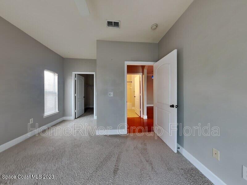 6450 Borasco Drive, Unit 3703 Melbourne, FL 32940 - Photo 6 of 13 a view of a room with large windows and closet