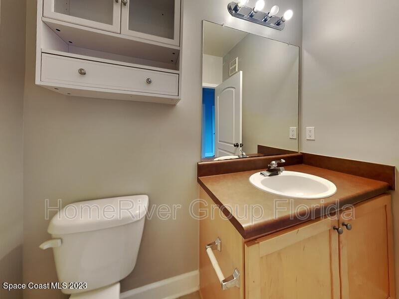 6450 Borasco Drive, Unit 3703 Melbourne, FL 32940 - Photo 9 of 13 a bathroom with a sink and a toilet