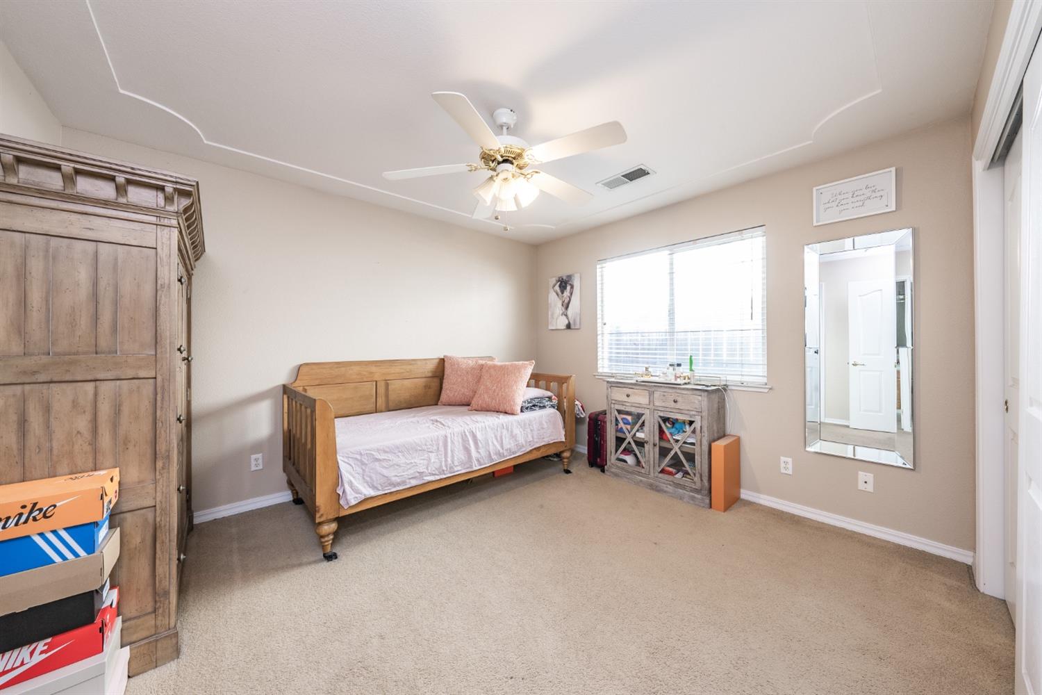 915 Trabon Way Madera, CA 93637 - Photo 22 of 33 a living room with furniture and a window
