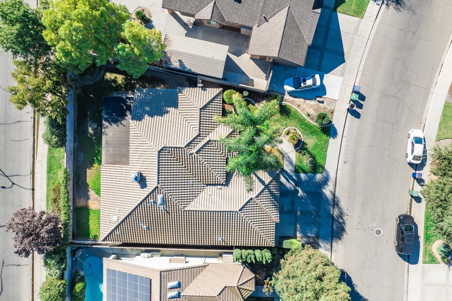 915 Trabon Way Madera, CA 93637 - Photo 29 of 33 an aerial view of a house with a yard and potted plants