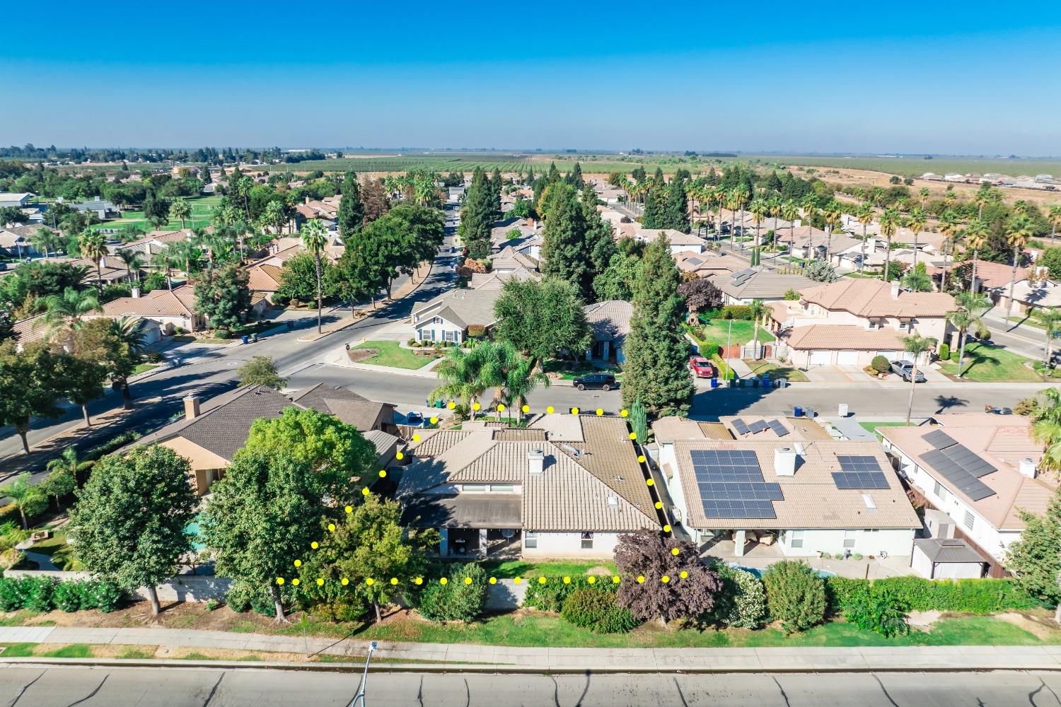 915 Trabon Way Madera, CA 93637 - Photo 32 of 33 an aerial view of a house with a yard and lake view