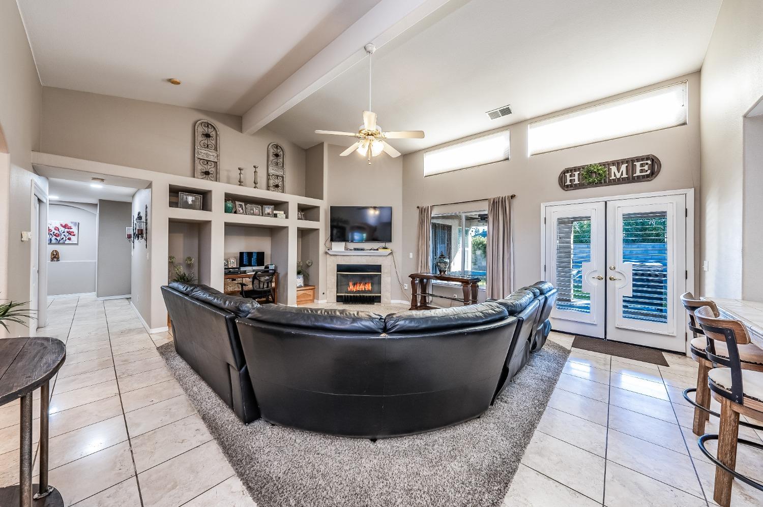 915 Trabon Way Madera, CA 93637 - Photo 8 of 33 a living room with furniture and a dining table