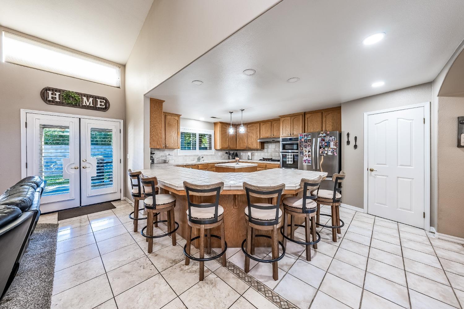 915 Trabon Way Madera, CA 93637 - Photo 10 of 33 a dining room with furniture and a floor to ceiling window