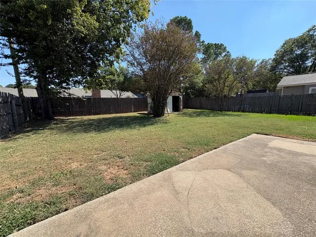 a view of a backyard with green space