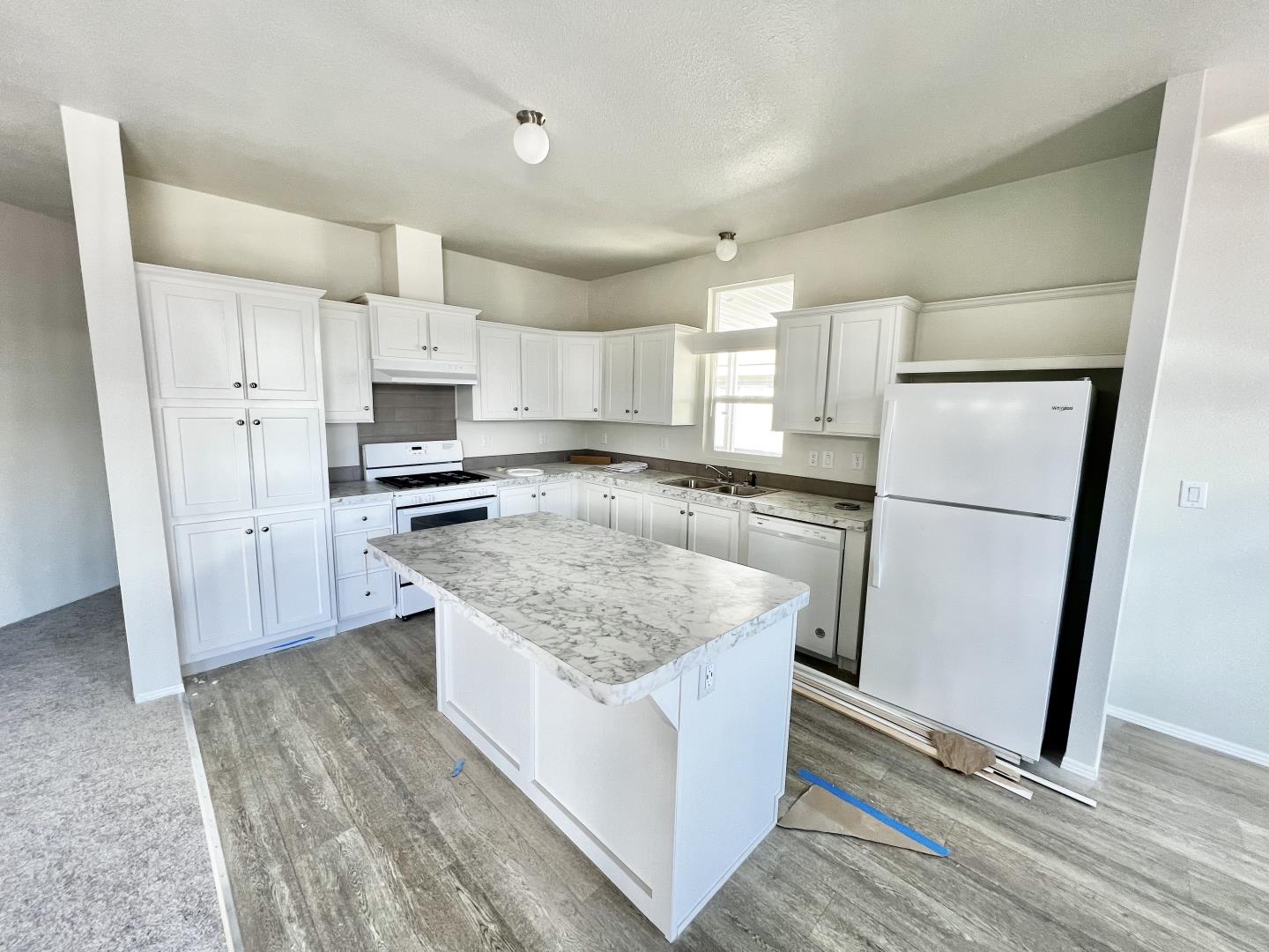 200 Ford Road, Unit 2 San Jose, CA 95138 - Photo 3 of 7 a kitchen with a refrigerator a sink and a stove