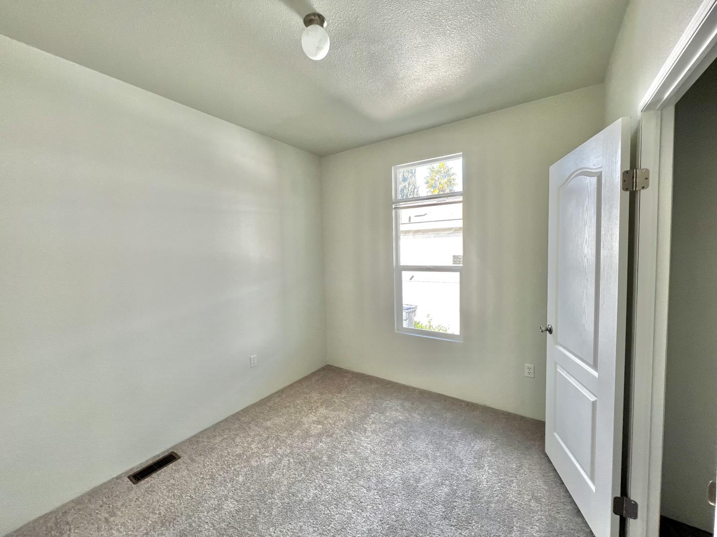 200 Ford Road, Unit 2 San Jose, CA 95138 - Photo 6 of 7 an empty room with windows