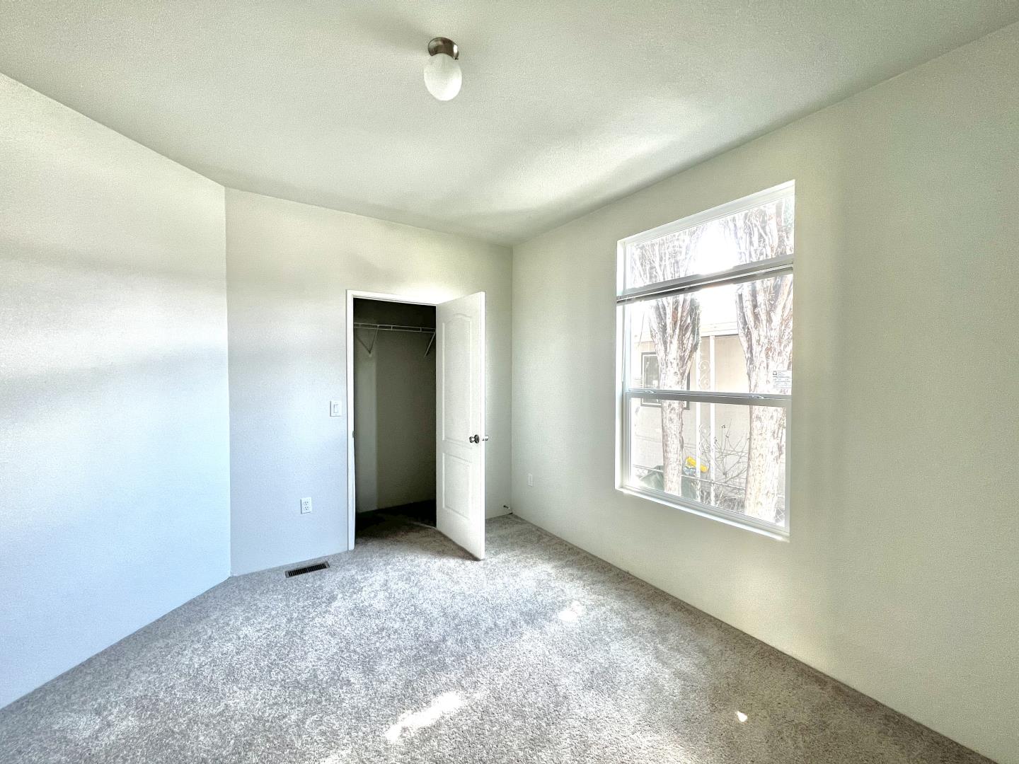 200 Ford Road, Unit 2 San Jose, CA 95138 - Photo 7 of 7 an empty room with windows and closet