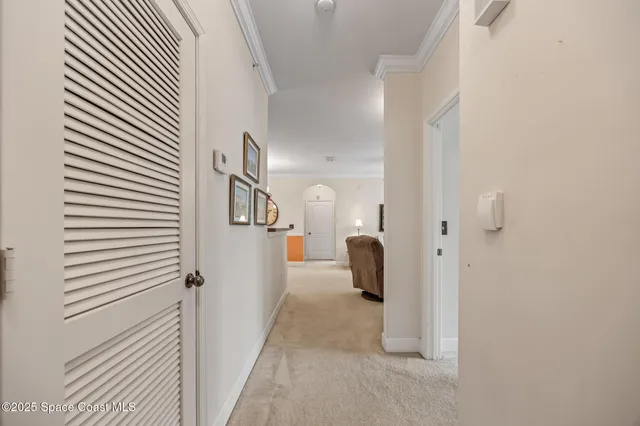 a view of a kitchen with a sink and a chandelier