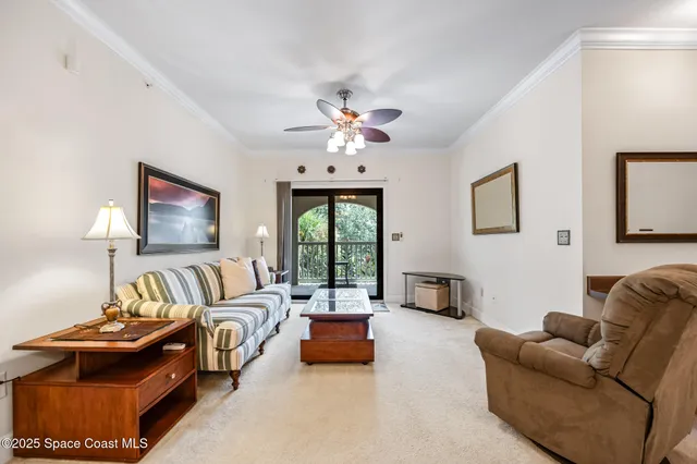 a living room with furniture and a mirror