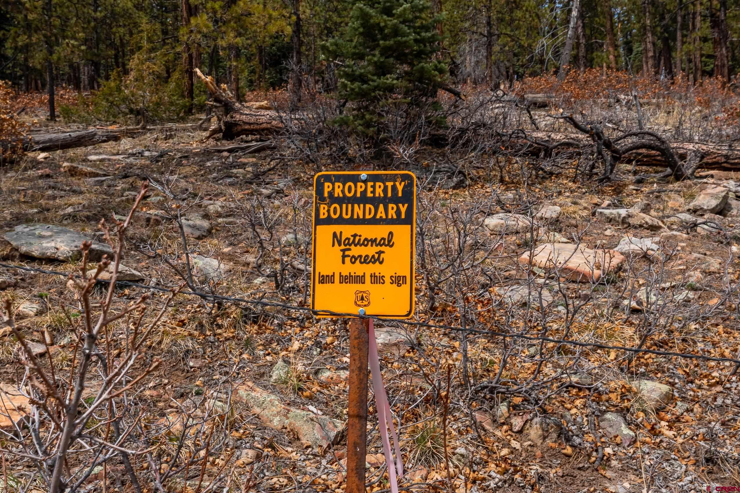 Lot 15 Taylor Ranch Road Durango, CO 81301 - Photo 25 of 35 a sign that is on a brick wall