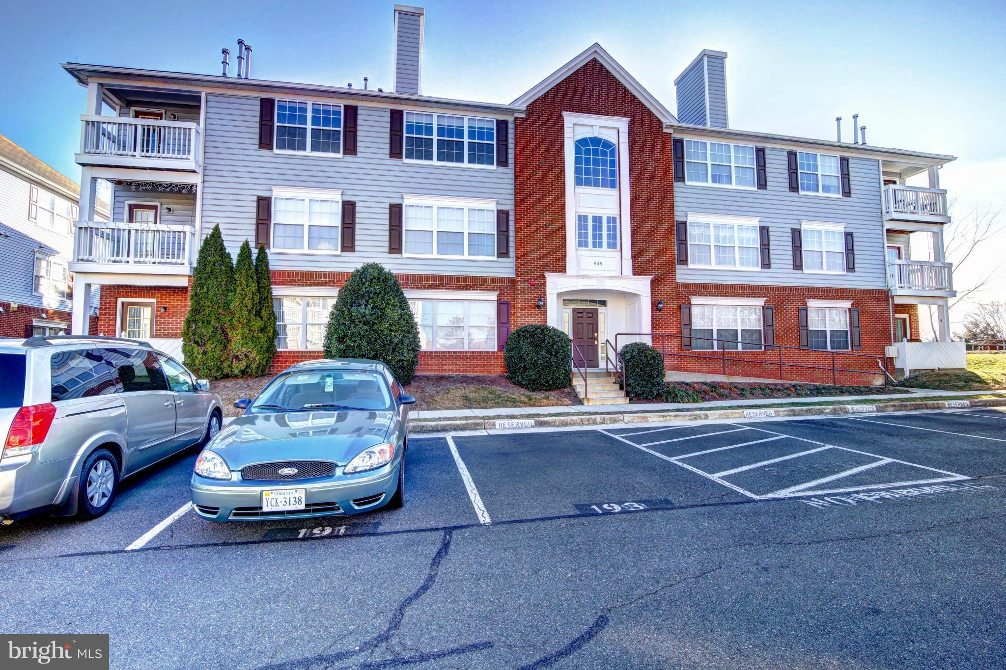 a car parked in front of a brick house