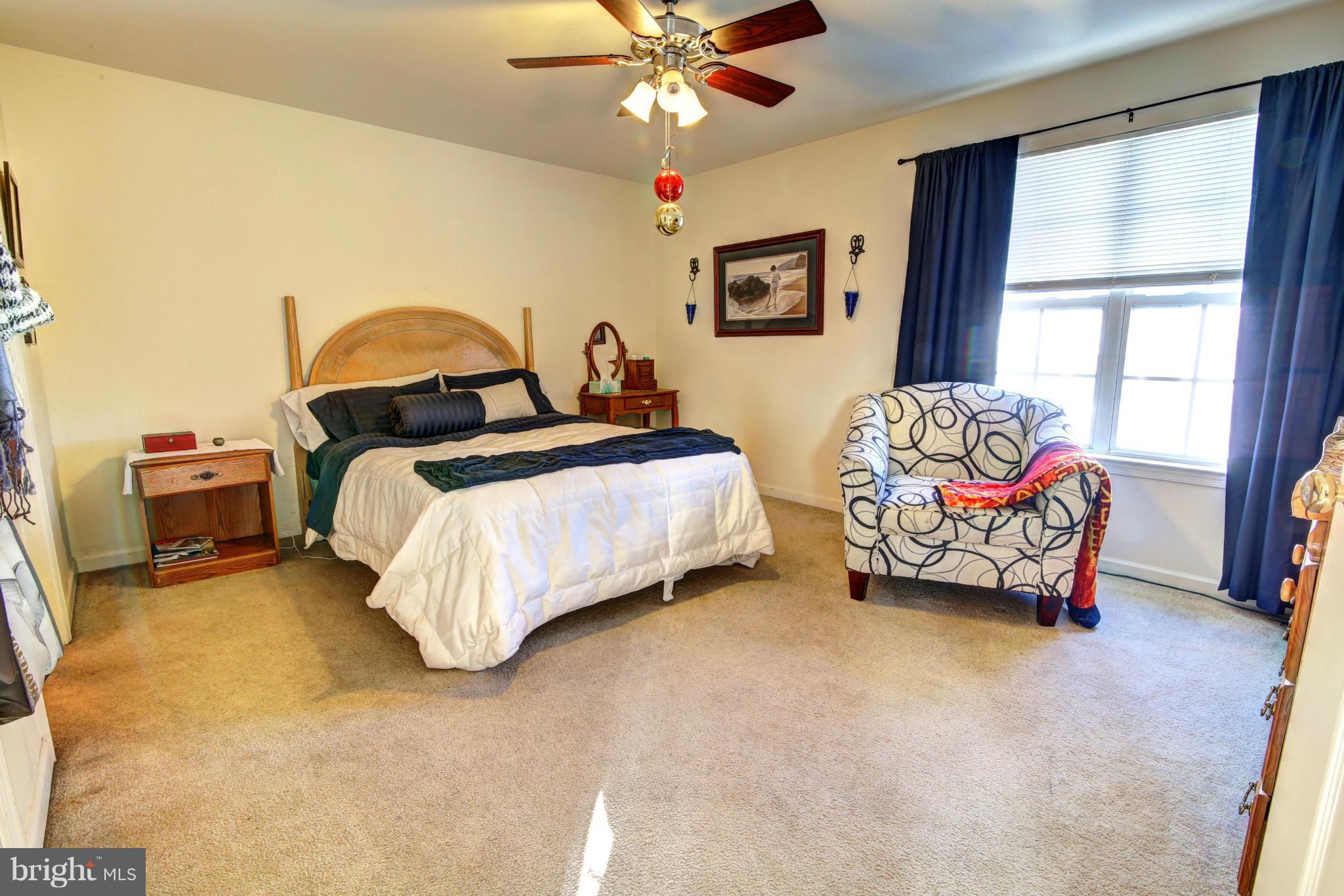 635 Constellation Square Southeast, Unit K Leesburg, VA 20175 - Photo 10 of 14 a bedroom with bed and window
