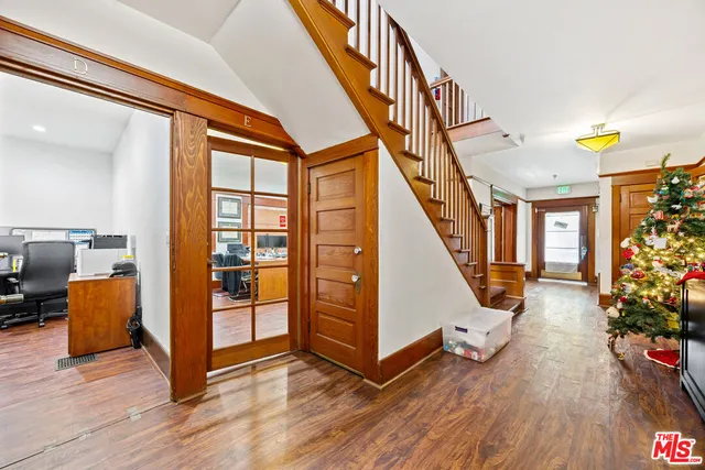 a view of entryway with wooden floor and furniture