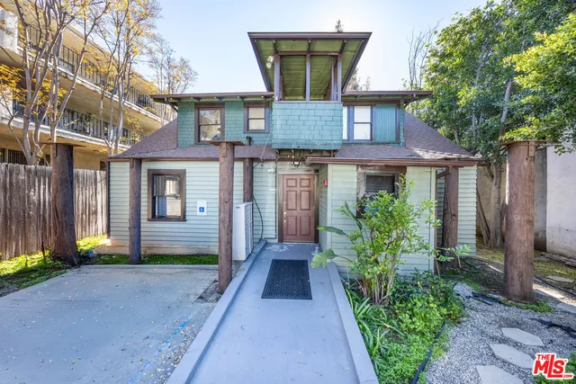 front view of a house with a small yard