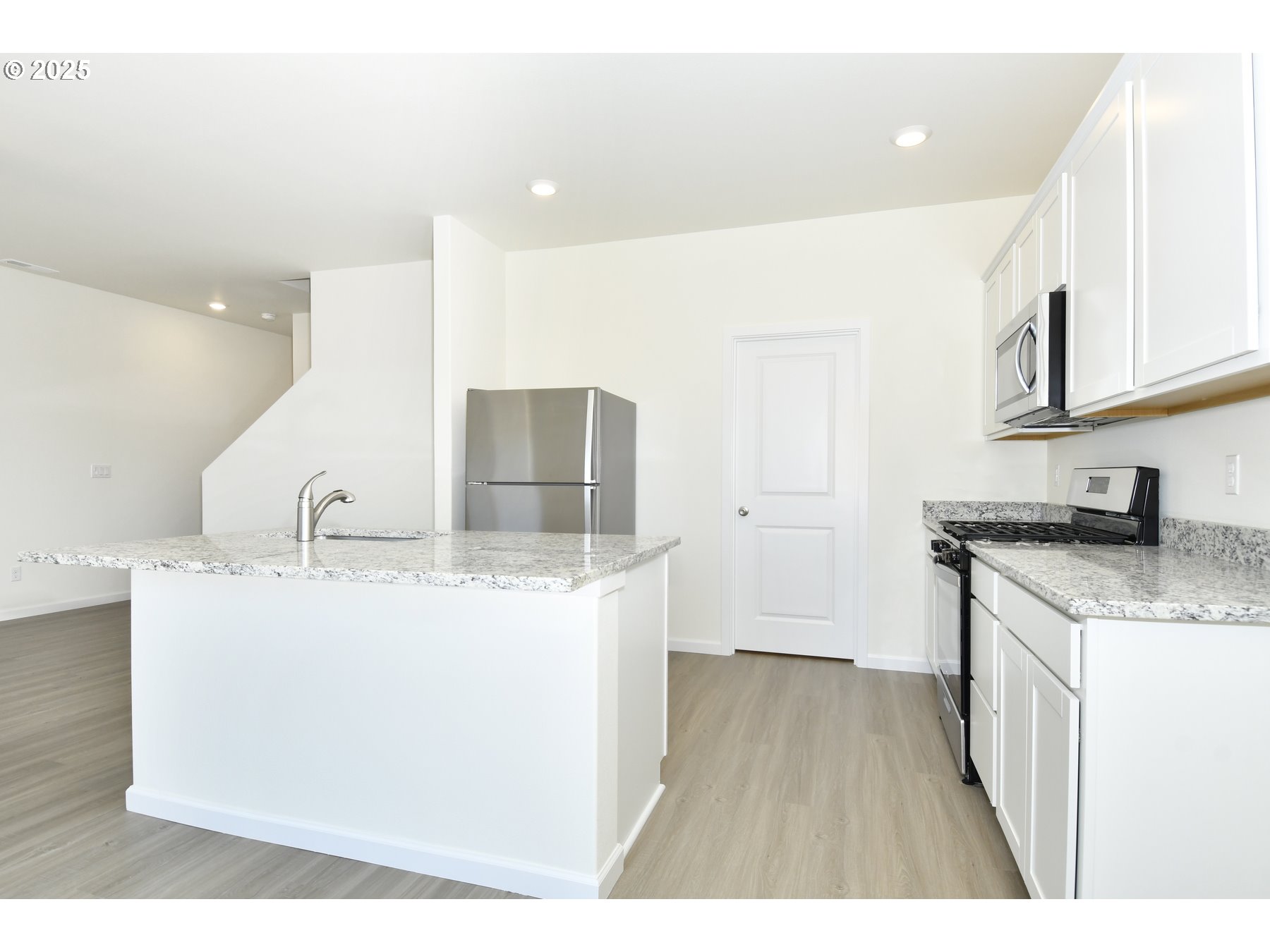 3915 Southwest Duniway Lane Gresham, OR 97080 - Photo 11 of 20 a kitchen with stainless steel appliances granite countertop a sink stove and cabinets