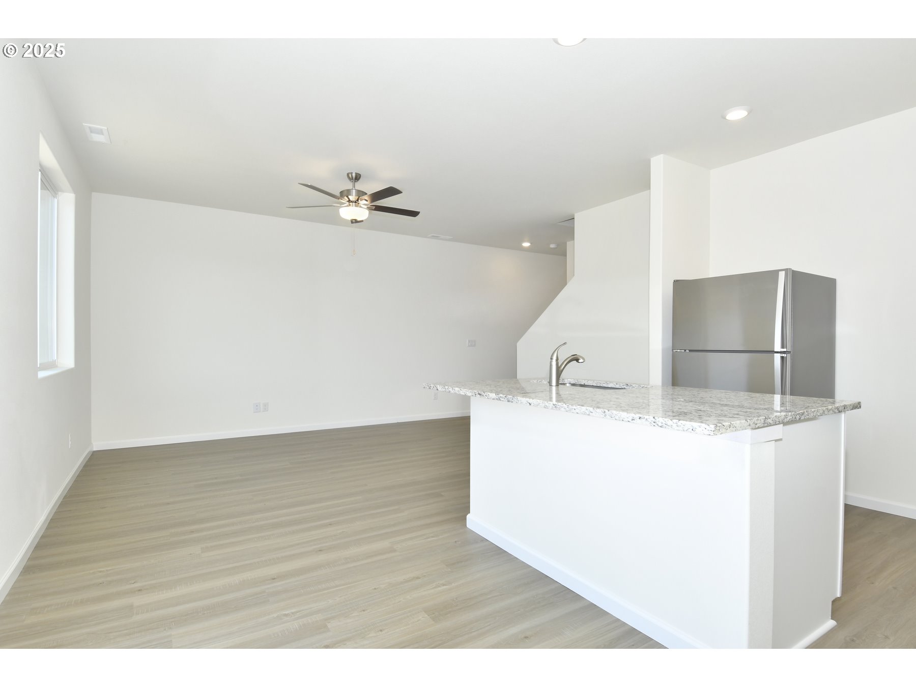 3915 Southwest Duniway Lane Gresham, OR 97080 - Photo 12 of 20 a view of a kitchen with a sink and a refrigerator