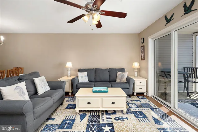 a bed room with a bed a couch and a window