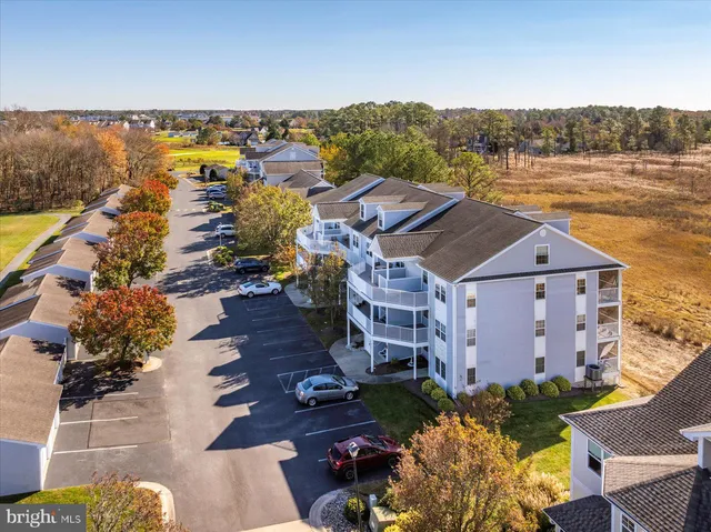 an aerial view of a house with a lake view