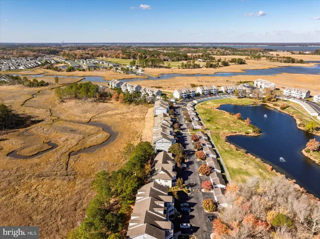 a front view of a building with a garden