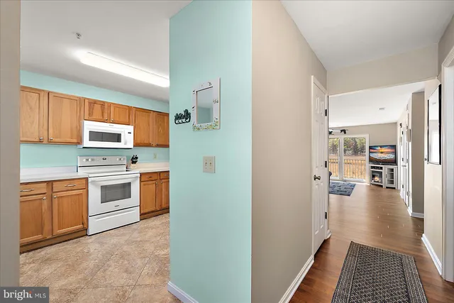 a kitchen with stainless steel appliances a stove top oven and sink