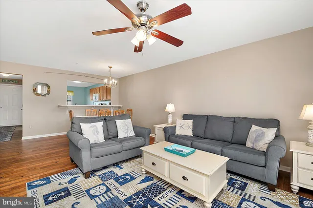 a living room with furniture and a rug