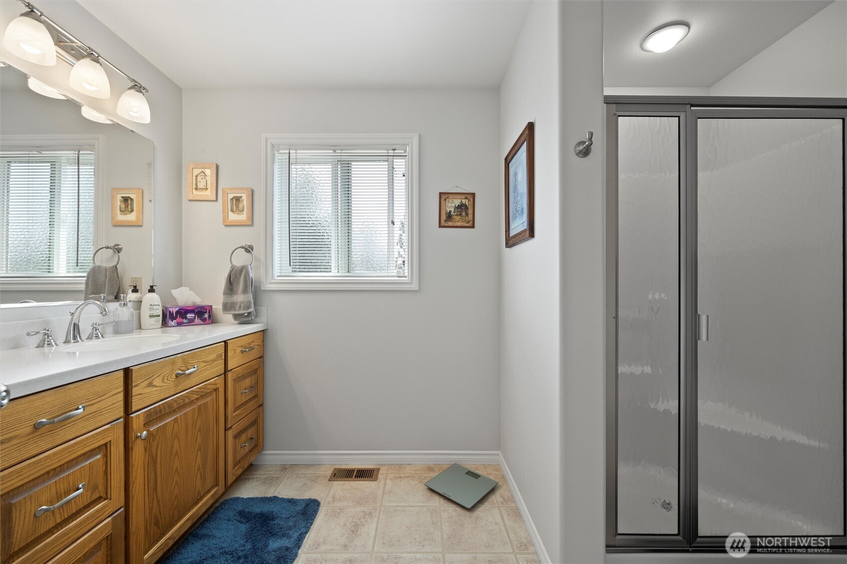 6379 Lewis Peak Road Waitsburg, WA 99361 - Photo 13 of 40 a bathroom with a sink and mirror with toilet