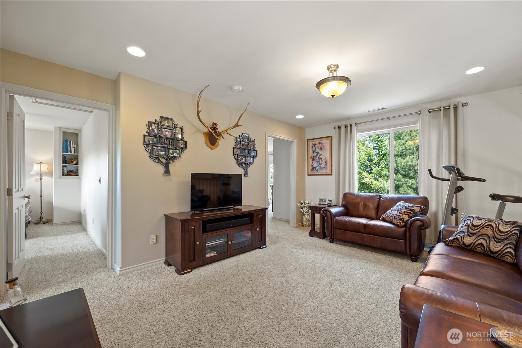 6379 Lewis Peak Road Waitsburg, WA 99361 - Photo 18 of 40 a living room with furniture a window and a flat screen tv