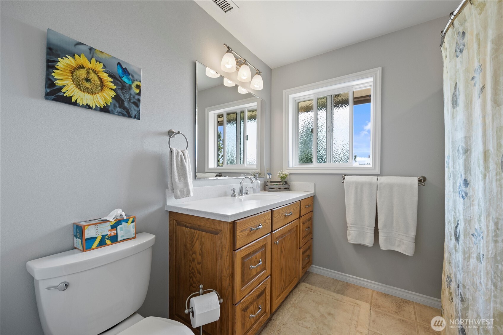 6379 Lewis Peak Road Waitsburg, WA 99361 - Photo 20 of 40 a bathroom with a sink a mirror and a toilet