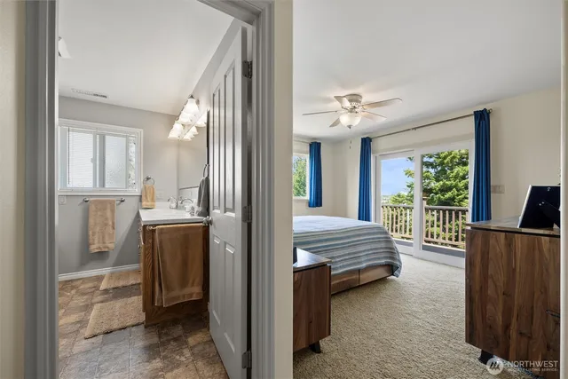 a bedroom with furniture and a chandelier