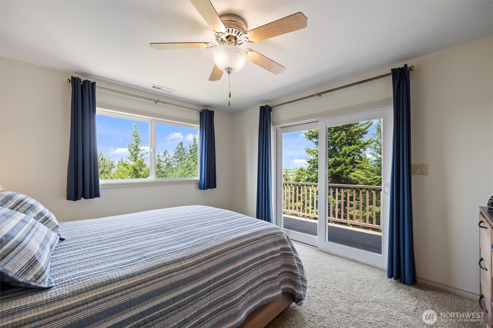 6379 Lewis Peak Road Waitsburg, WA 99361 - Photo 23 of 40 a bed sitting in a bedroom next to a window