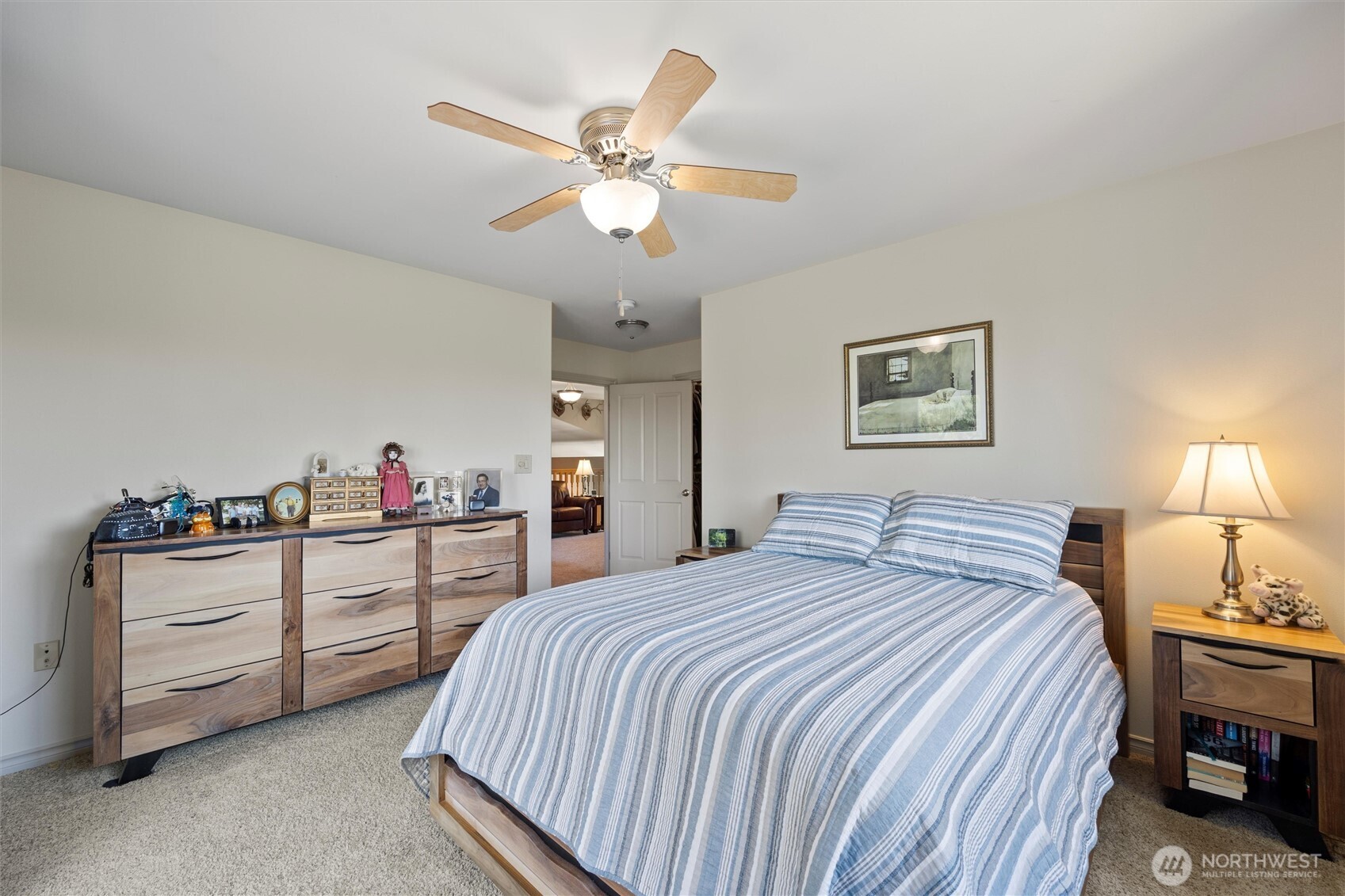 6379 Lewis Peak Road Waitsburg, WA 99361 - Photo 24 of 40 a bedroom with a bed and a chandelier