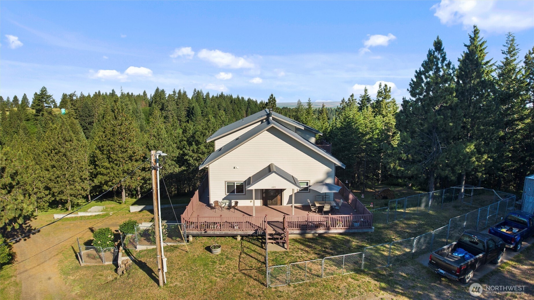 6379 Lewis Peak Road Waitsburg, WA 99361 - Photo 4 of 40 a view of a house with a yard and sitting area