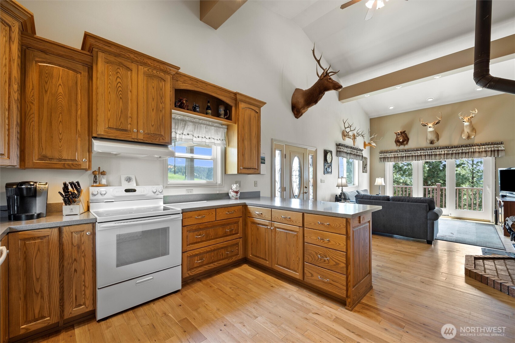 6379 Lewis Peak Road Waitsburg, WA 99361 - Photo 7 of 40 a kitchen with stove a sink and cabinets