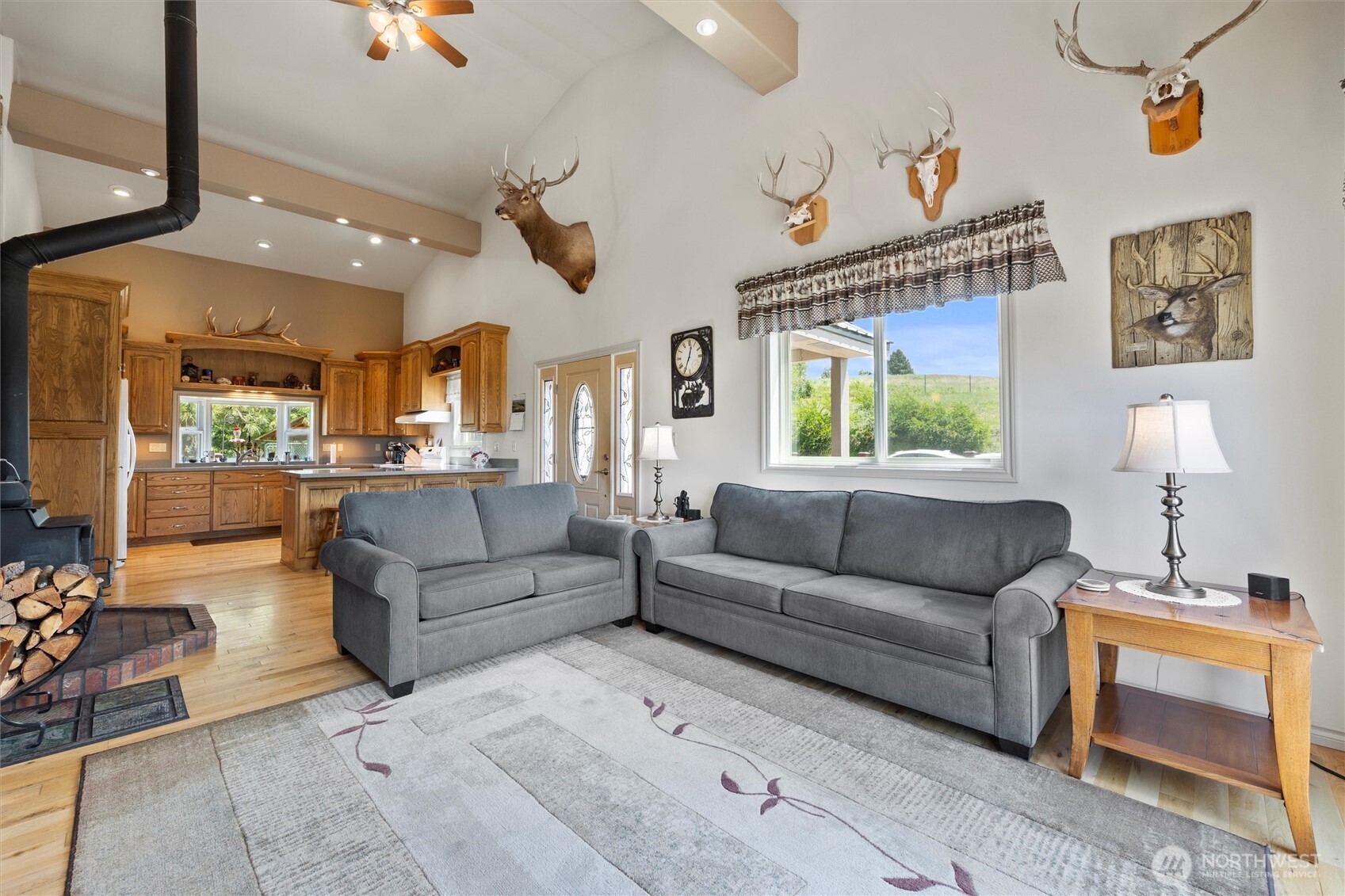 6379 Lewis Peak Road Waitsburg, WA 99361 - Photo 9 of 40 a living room with furniture and a chandelier