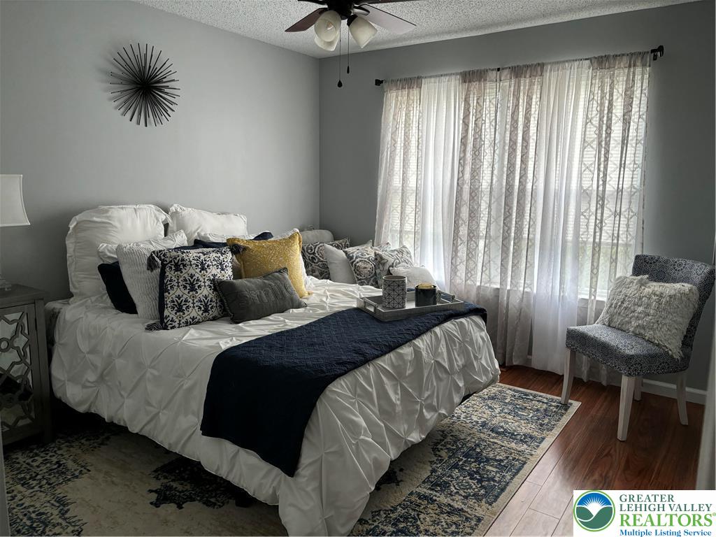 1963 Delancey Street Hellertown, PA 18055 - Photo 13 of 26 a bedroom with a bed and a chair