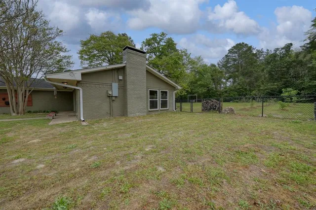a house with trees in the background