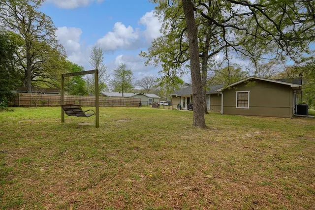 a backyard of a house with lots of green space