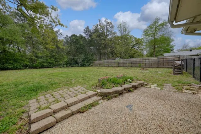 a view of a field with sitting area